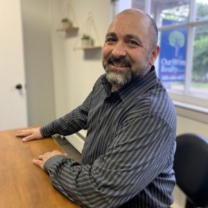 paul-headshot-at-desk-cropped-1